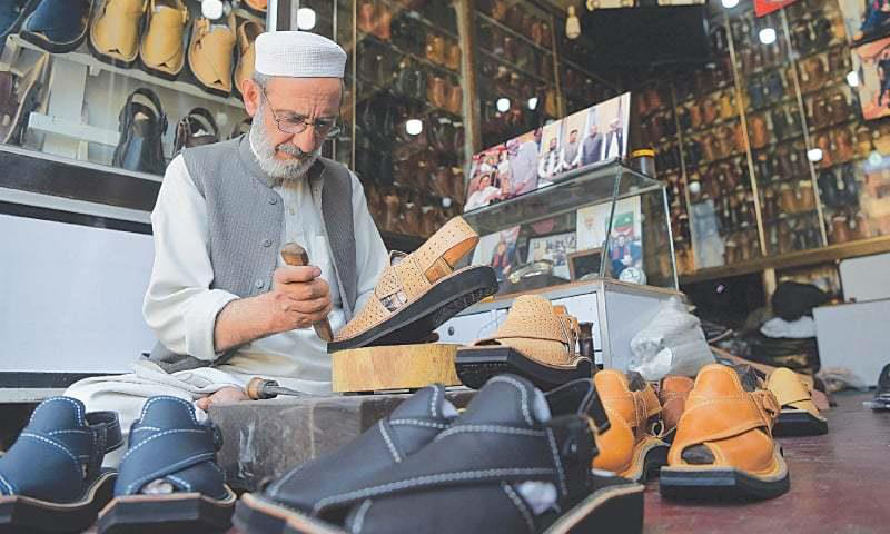 Artisan making handmade chappals